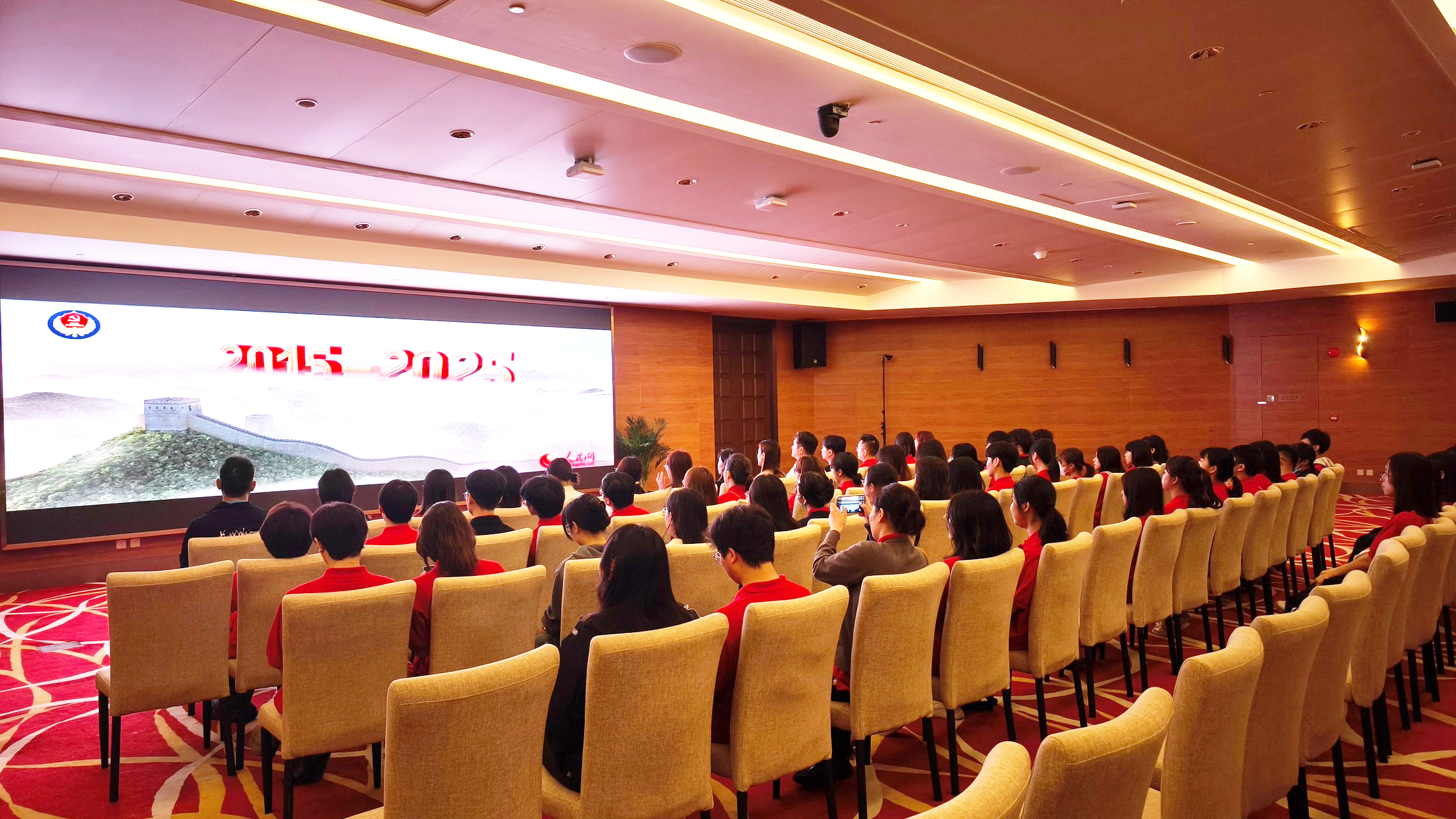 Teachers and students watch a short film on national security.